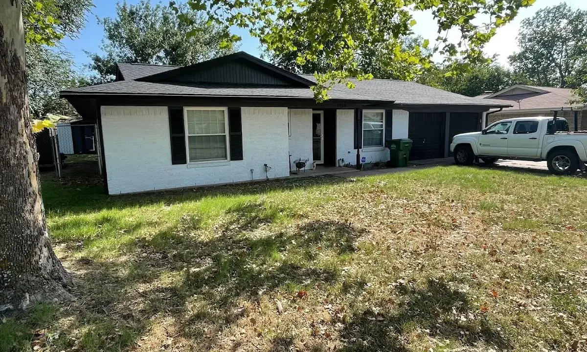 Professional roofing crew working on a residential roof in Hasbrouck Heights
